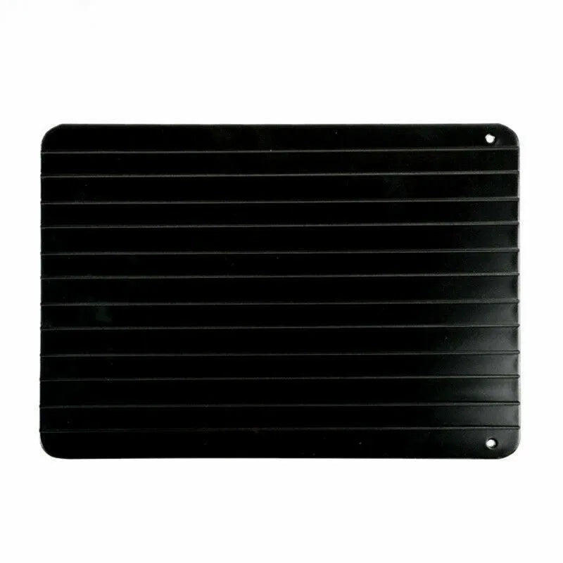 Black aluminium fast defrosting tray for thawing frozen food on kitchen counter
