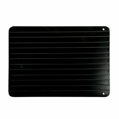 Black aluminium fast defrosting tray for thawing frozen food on kitchen counter