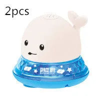 Automatic water-spraying whale bath toy with colourful lights floating in bath water.