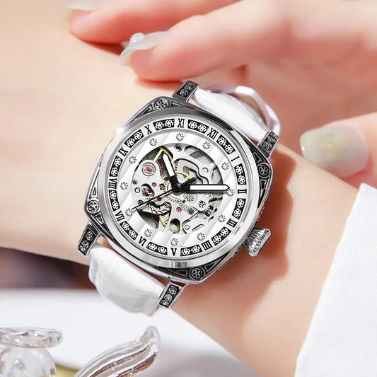 Mechanical watch with luminous hands on leather belt, stainless steel case, showing black colour option