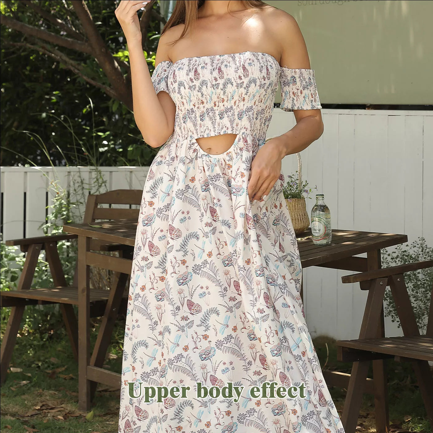 Women's off shoulder strapless floral dress in a lightweight fabric, available in multiple sizes.