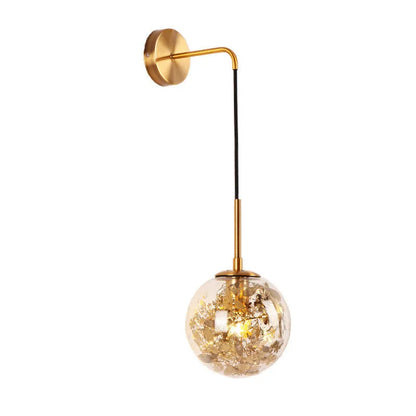 Glass wall lamp with golden flower finish and 15cm diameter, mounted beside bed with LED illumination