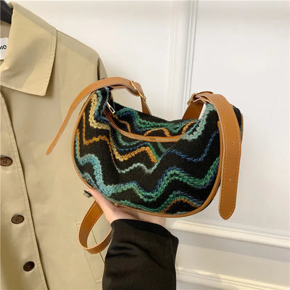 Women's woven straw crossbody bag with internal phone and file pockets in various colours.