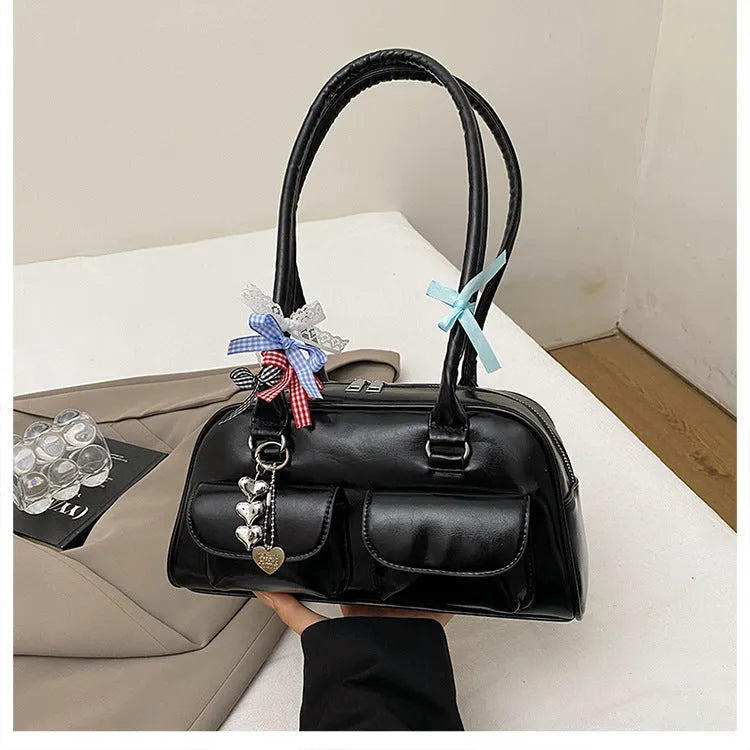 Retro brown PU leather women's pillow bag with a double shoulder strap and flap closure.