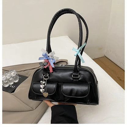 Retro brown PU leather women's pillow bag with a double shoulder strap and flap closure.