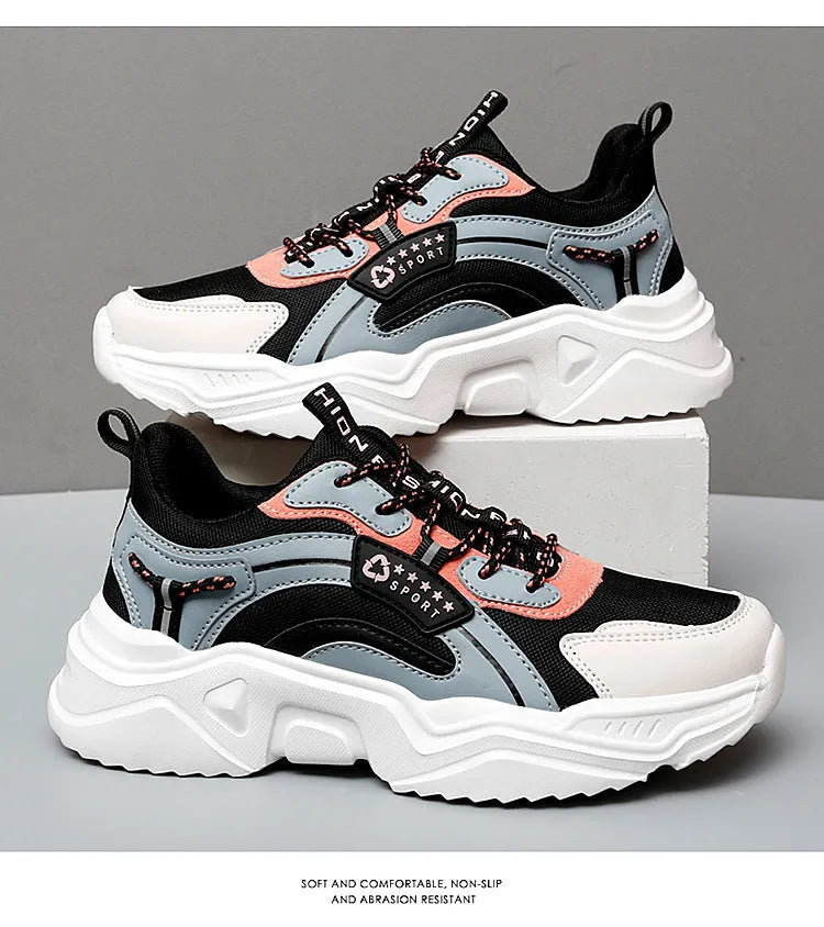Women's white casual sports shoes with mesh upper, thick sole, buckle strap, and round toe.