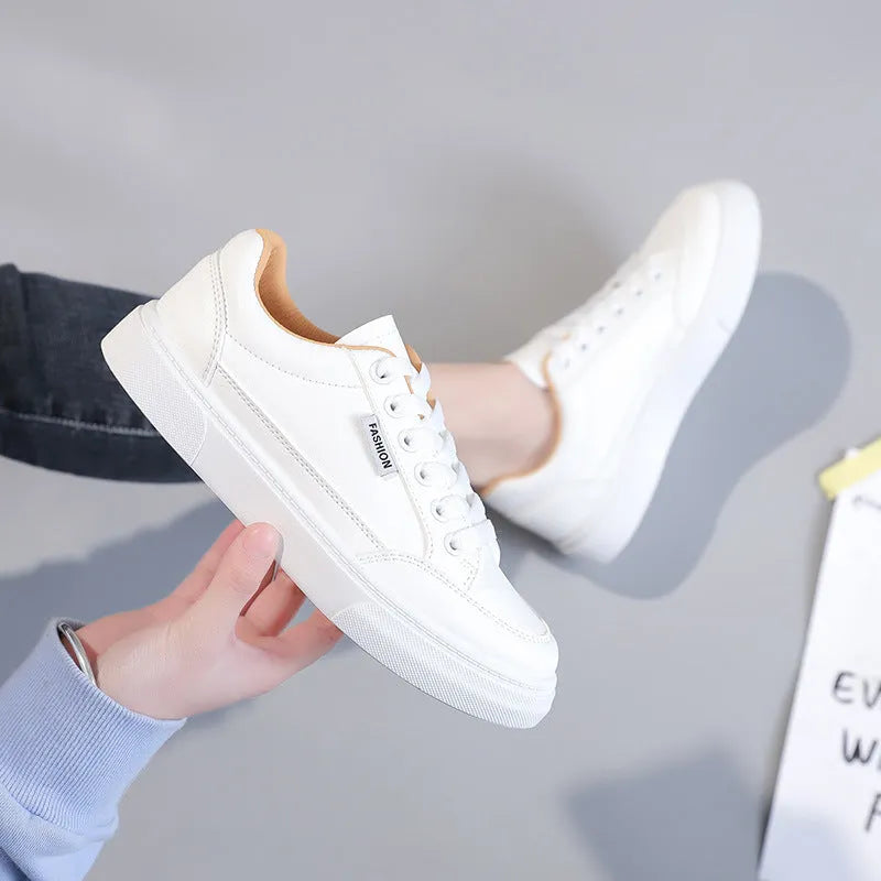 Low-top Korean style student sneakers in artificial PU leather available in white or brown with shock-absorbing plastic sole and wear-resistant design for everyday casual wear and comfortable fit across six sizes