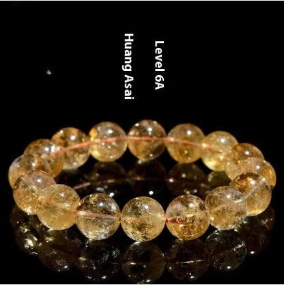 Natural yellow citrine bracelet with geometric beads in various sizes from 4mm to 20.8mm diameter on wrist
