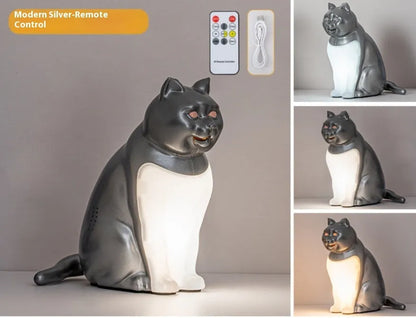Cat-shaped USB rechargeable table lamp with adjustable colour temperature on wooden desk