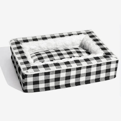 Classic plaid pattern dog kennel with removable cloth cover shown next to a matching cushion