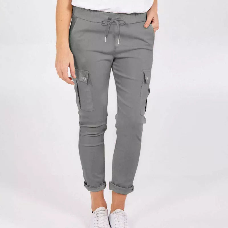 Women's casual cargo pants in royal blue, navy blue, and apricot with drawstring waist and multiple pockets