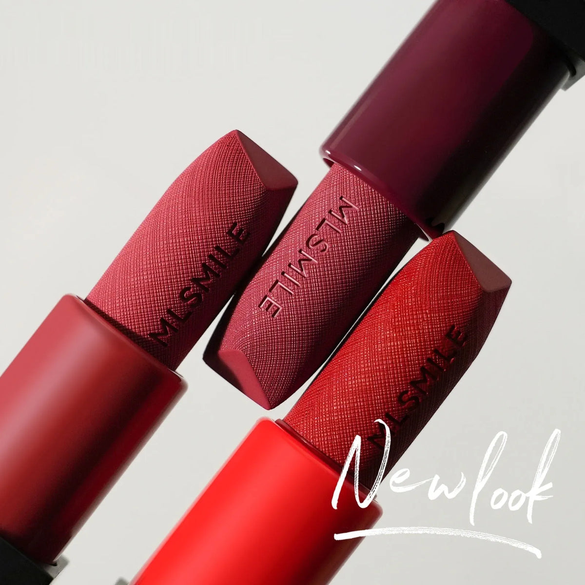 MLSMILE embossed lipstick three-piece set in open box showing three lipsticks.