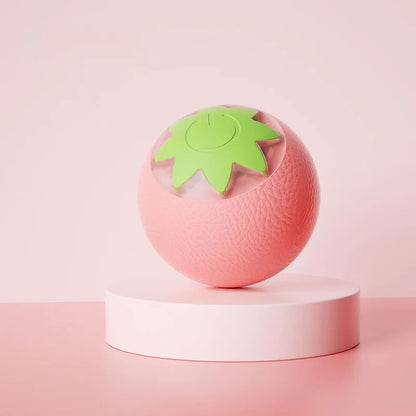 Green automatic rotating ball pet toy for dogs and cats on indoor flooring