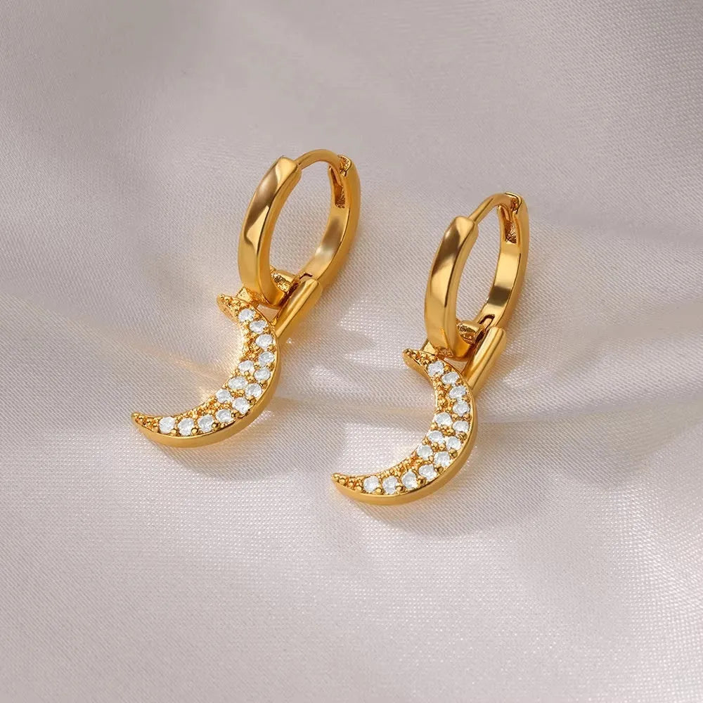 Women's irregular geometric butterfly earrings in copper with diamond treatment, showing heart-shaped and star designs in various colours