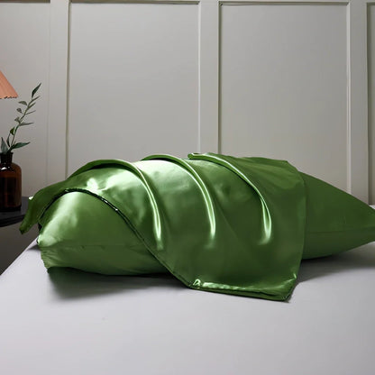 Silk-effect satin envelope pillowcase in navy blue showing envelope closure and smooth fabric texture