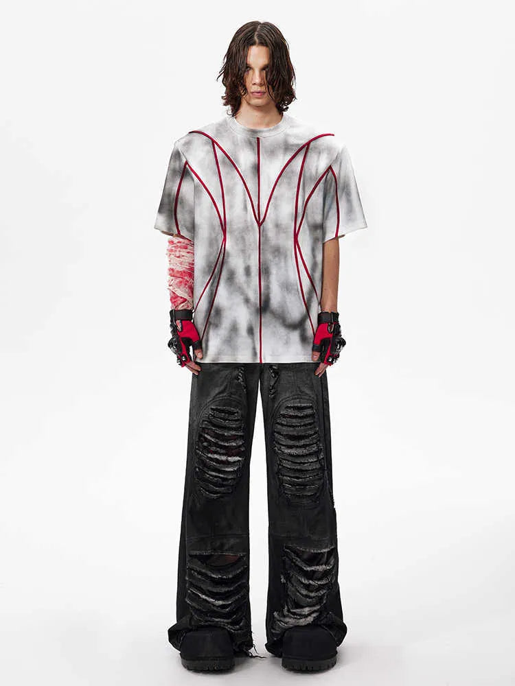 Padded shoulder short sleeve t-shirt with raised 3D line patchwork detailing on the front.