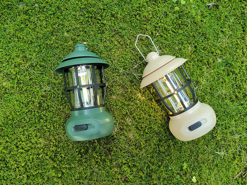 Black vintage-style iron camping lantern with USB charging and LED light, for tent and campsite use.