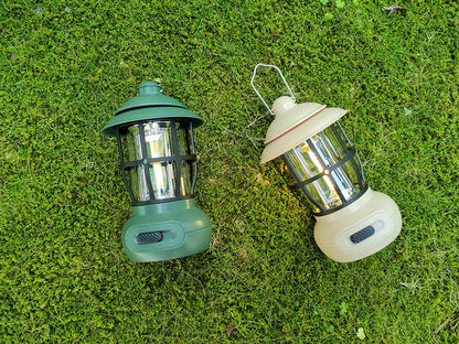 Black vintage-style iron camping lantern with USB charging and LED light, for tent and campsite use.