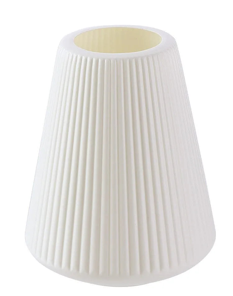 Melamine plastic decorative vase in blue colour measuring 16cm by 20cm on wooden desk