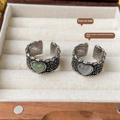 Retro wide-faced heart-shaped silver ring with adjustable opening in white or green colour
