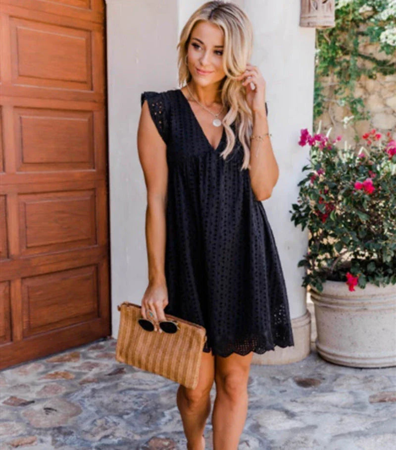 A sleeveless summer dress with a unique jacquard design, lace details, and pockets in various colors