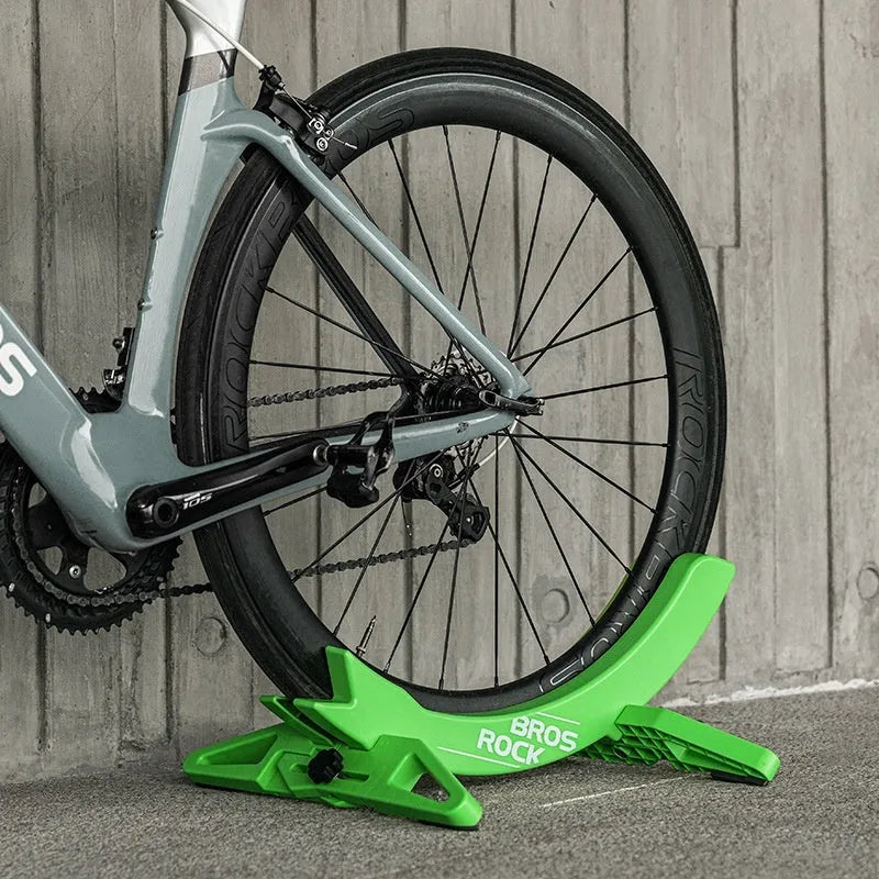Black ABS plastic wall-mounted bicycle parking rack holder for road and mountain bikes.