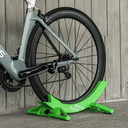Black ABS plastic wall-mounted bicycle parking rack holder for road and mountain bikes.