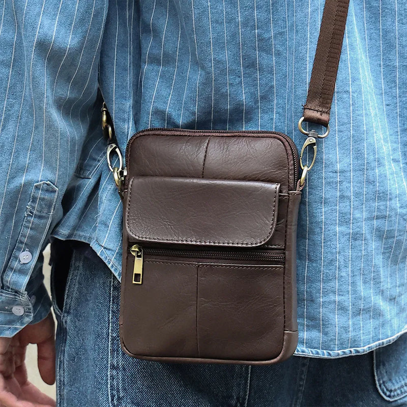 Men's genuine leather crossbody shoulder bag with polyester cotton lining in first layer cowhide material for leisure travel in black, brown, and coffee colour options featuring solid colour design and cross-border fashion style