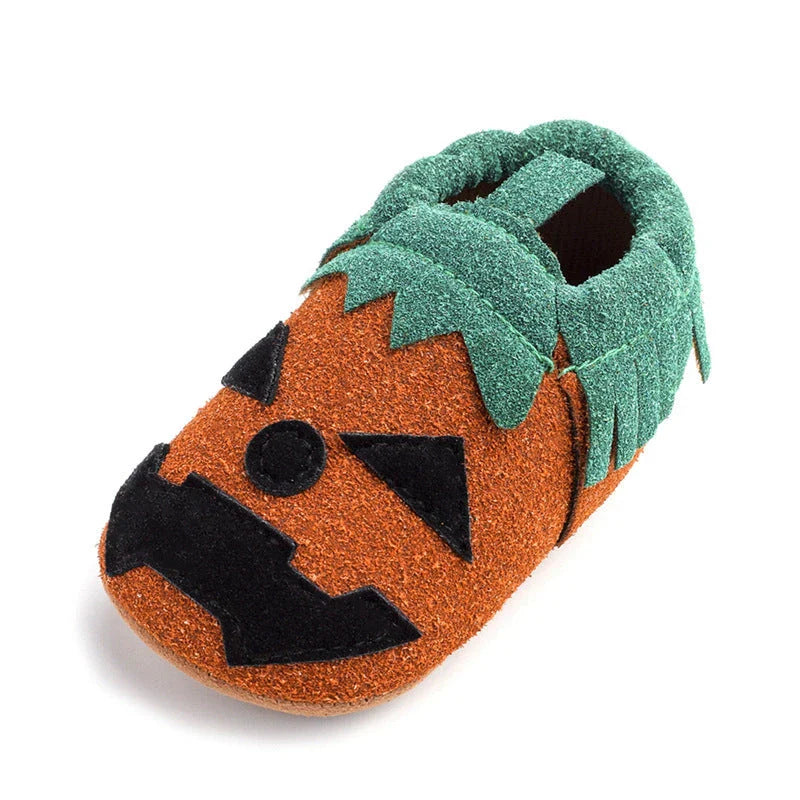 Adorable pumpkin-themed baby shoes with soft suede upper and non-slip canvas sole, available in vibrant yellow color and range of sizes