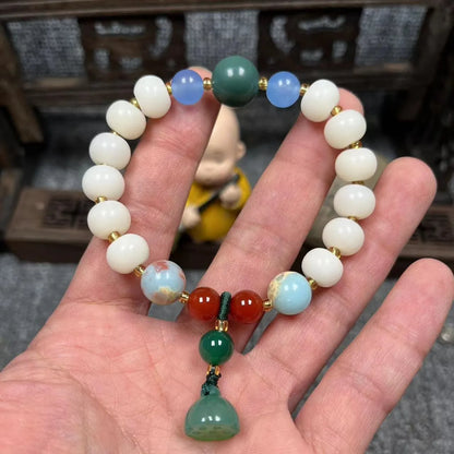 White Bodhi root bracelet with carved pumpkin lotus beads including Apple Orchard and Duobao styles