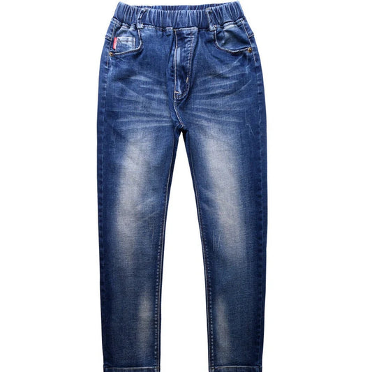 Boys' black micro-stretch cotton jeans showing 4-way flexibility and middle waist design