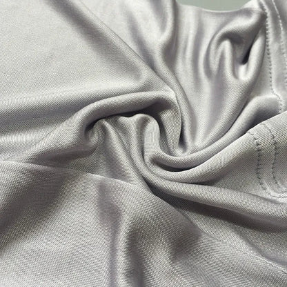 Men's loose-fitting silk shorts in navy blue on a neutral background.