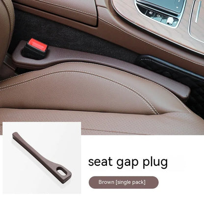 Flexible polyurethane car seat gap filler strip in selected colour next to car keys and phone.