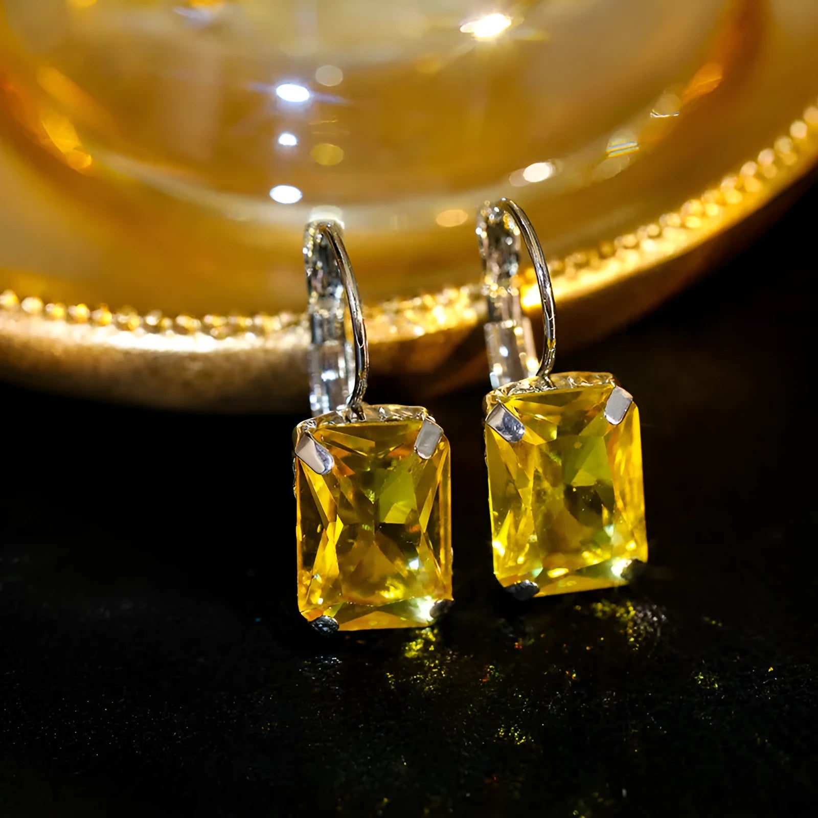 Women's square crystal earrings in copper with purple, red, and yellow colour options measuring 25mm by 10mm.
