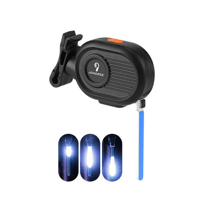 Bicycle rear safety light with a cascading waterfall LED light effect, mounted on a seat post.