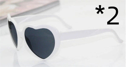 Stylish heart-shaped lighting sunglasses with a plastic frame and resin lenses, creating a mesmerizing effect for romantic occasions