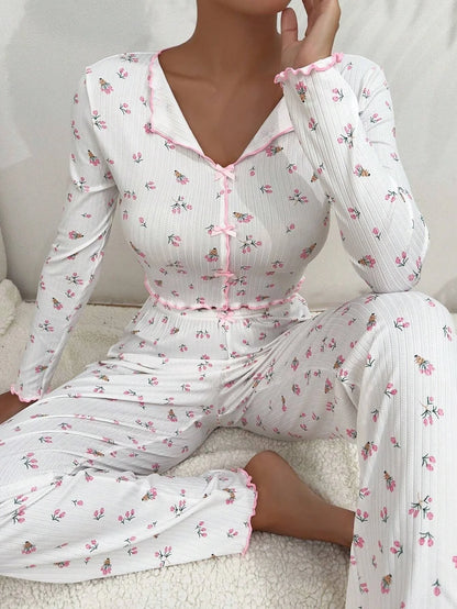 Stylish two-piece loungewear set in vibrant floral prints, featuring a long sleeve top and coordinating pants for all-season comfort and versatility.