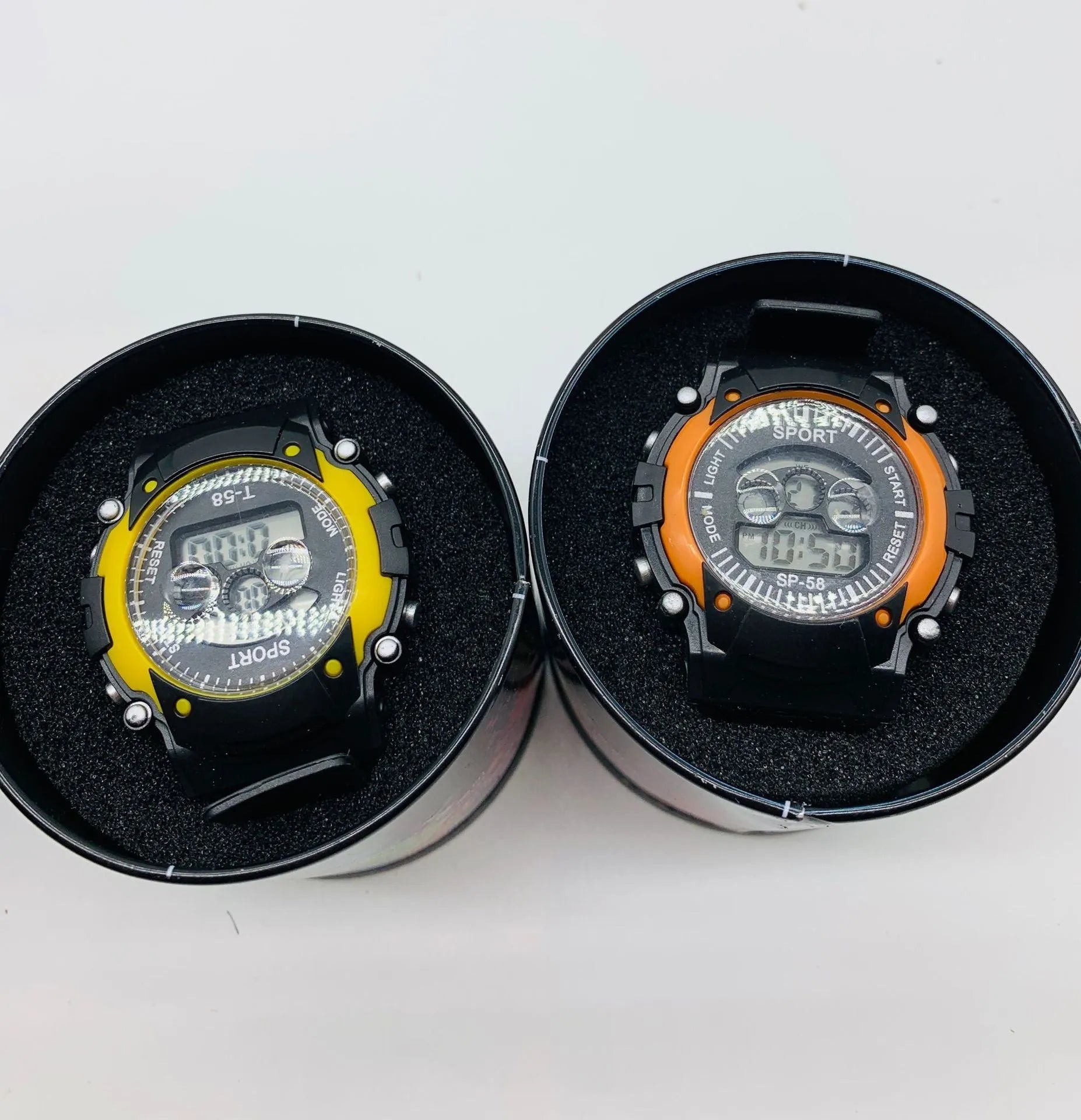 Digital sports watch for children with silicone strap, plastic case, and mixed colour display