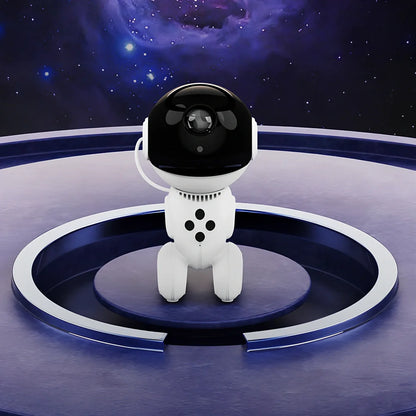 White robot-shaped star light projection lamp with USB cable and remote control on table