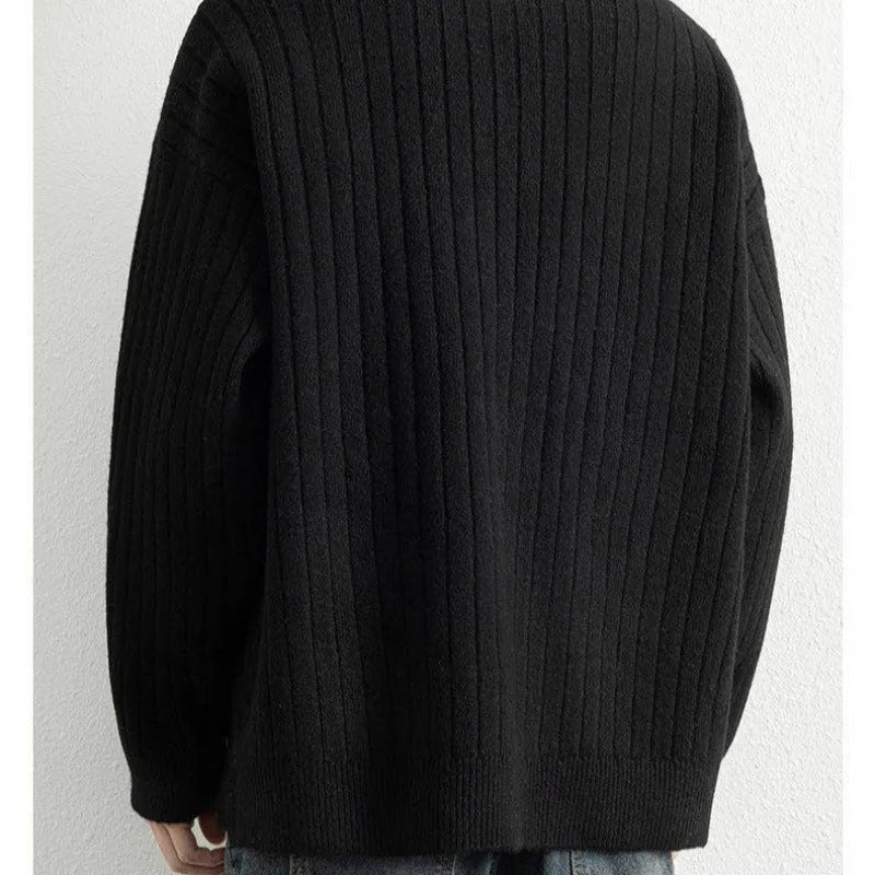 Men's grey half-zip pullover sweater with textured knit and loose fit, showing front view with zip partly open.