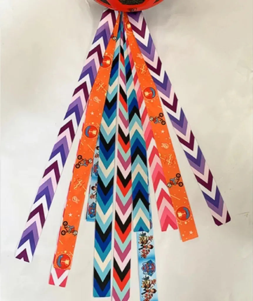 Children's helmet streamer with 60 cm polyester ribbon in colours like apricot and khaki for roller skating and skiing