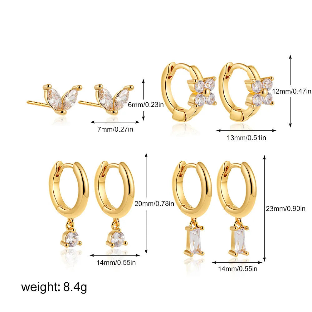 A set of geometric and star-shaped copper earrings with zircon accents in gold or silver plating.