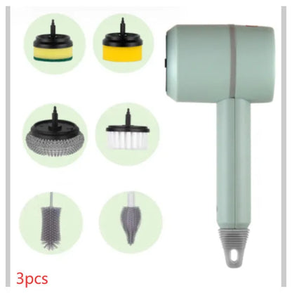 Green electric cleaning brush with scouring pad and brush heads on a kitchen worktop.