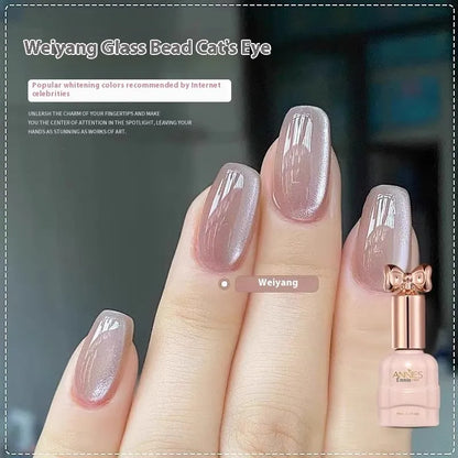 Bottle of micro glass bead cat's eye gel nail polish for magnetic nail art.
