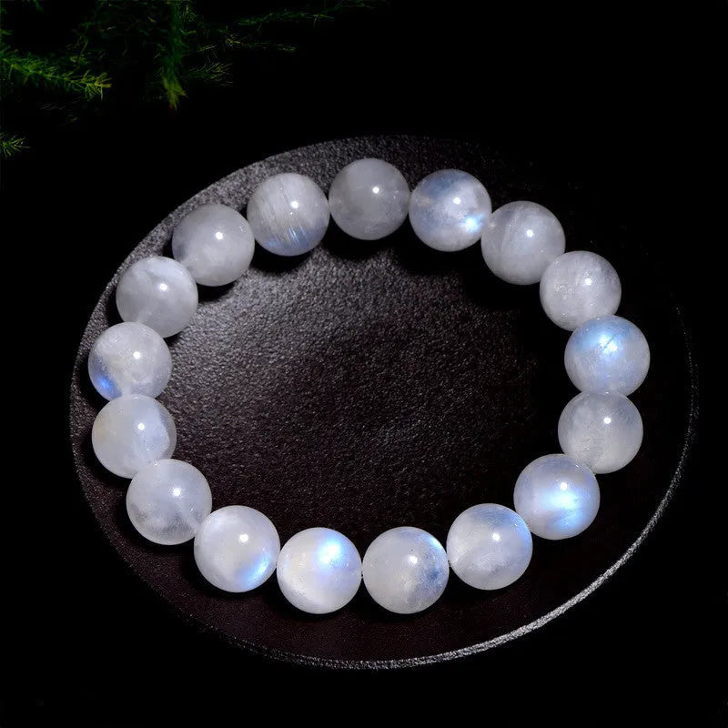 Natural blue moonlight round bead bracelet in white with polished moonstone beads showing blue sheen effect