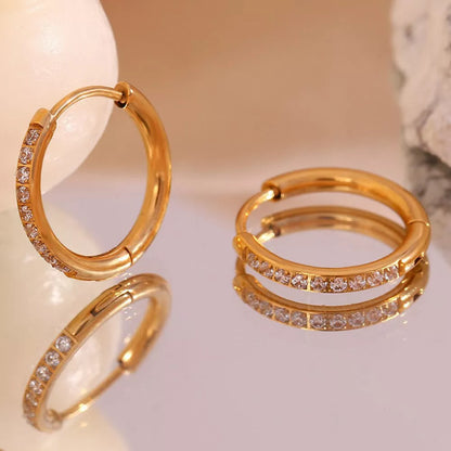 Women's titanium steel rounded edge zircon earrings in gold and steel finishes, sizes 10mm to 16mm