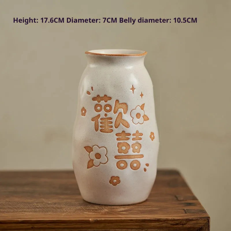 Hand-painted Chinese ceramic vase with carved detail on a desk, shown in Double Happiness colour design.