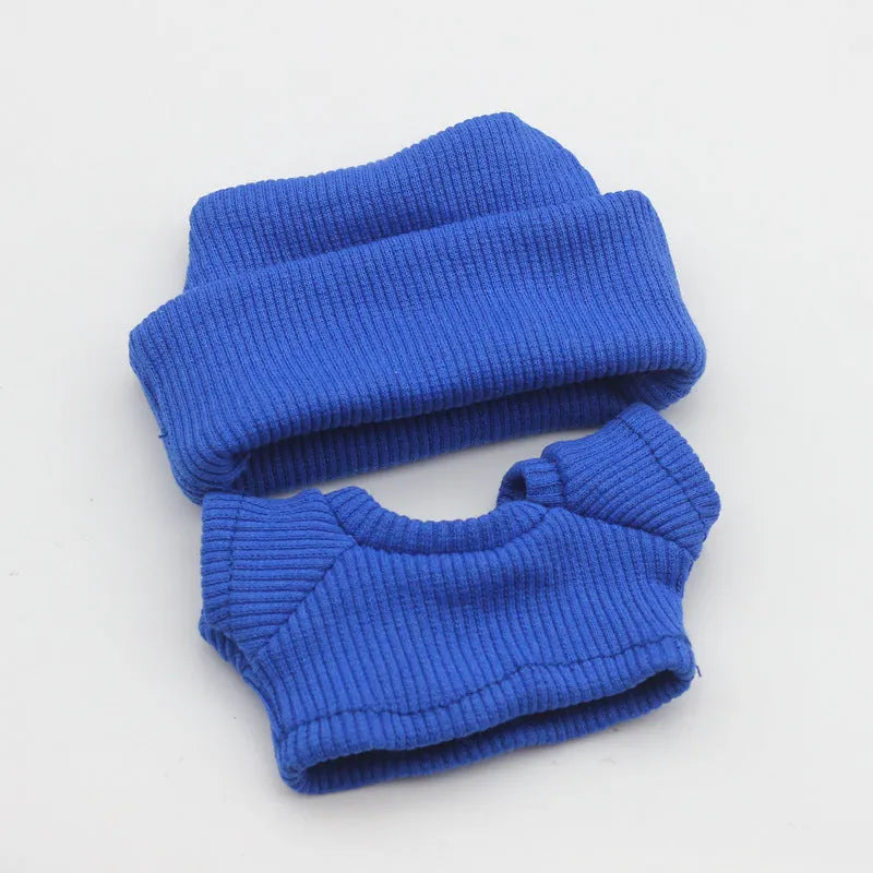 Doll clothes set with knitted flanging hat and T-shirt in multiple colours including pink, white, and stripes.