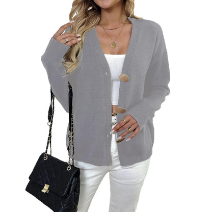 Women's grey deer plush long sleeve sweater coat with princess sleeves on a hanger.
