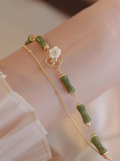 Natural olivine double layer bracelet with olive branch charms on wrist